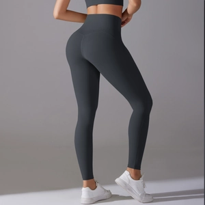 Side view of dark grey high waisted seamless yoga leggings showing body shaping contour