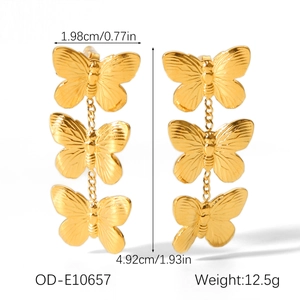 Detailed view of triple butterfly earrings in gold finish with size and weight specs