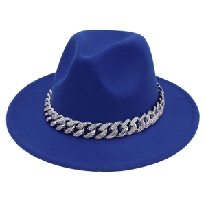 Detail of royal blue fedora hat with sparkling rhinestone encrusted silver curb chain