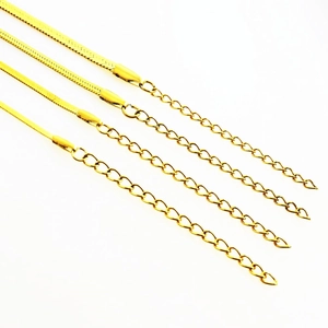 Detailed close-up of four gold stainless steel snake chains with extension links