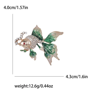 Green and beige enamel goldfish brooch with crystals and red gemstone eyes for women
