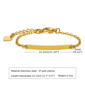 Macro detail of adjustable gold plated stainless steel bar bracelet with heart charm