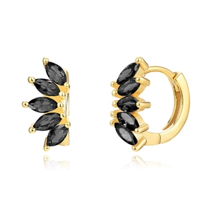 Macro shot of gold hoop earrings featuring five black marquise gemstones in a fan pattern