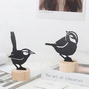 Minimalist iron bird silhouettes on natural wood bases for modern home decor, set of two