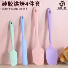 Silicone baking spatula set of 4 in macaron colors on a pink and white background