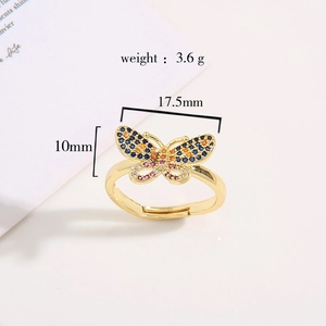 Macro shot of gold butterfly ring with colorful cubic zirconia and dimension labels