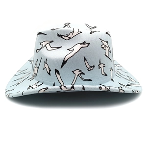 Close-up of light blue fedora hat with white and black seagull patterns and wide brim