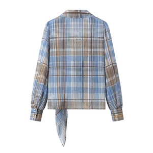 Women's plaid long sleeve shirt in blue and brown with decorative tie-back detail