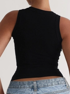 Close-up back view of a black ribbed sleeveless crop top paired with light blue jeans