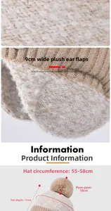Detail view of thickened knit earflap hat showing dimensions and plush pompom texture