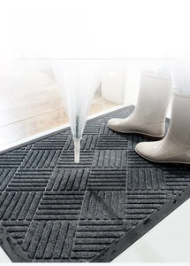 Detailed texture of non-slip gray polypropylene door mat for indoor and outdoor entryway