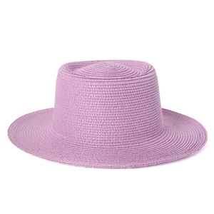 Minimalist lavender straw boater hat with a flat top for sun protection and travel