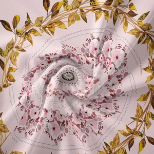 Macro shot of mandala tapestry fabric with pink floral patterns and soft silky texture
