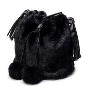 Chic black plush faux fur bucket bag with leather strap and decorative pom-poms