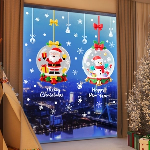 Close-up of Santa Claus and snowflake static stickers on window for holiday decoration