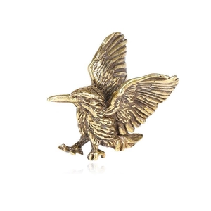 Vintage solid copper hummingbird keychain pendant with detailed feather carving on white background