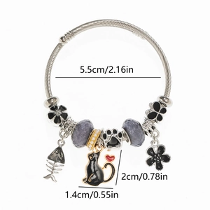 Detail view of crystal beaded bracelet with black cat and fishbone charms with dimensions