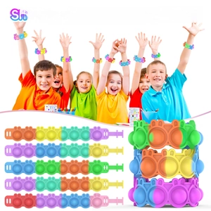 Detail of colorful rainbow silicone pop-it wristbands with cute bunny ears for kids