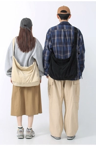 Corduroy tote bags in black and beige shown on models for a casual large capacity style