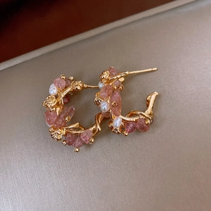 Macro detail of 18k gold-plated vine earrings with strawberry quartz and small pearls