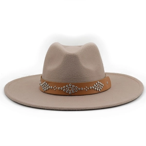 Detailed view of wide brim felt fedora hat with studded leather band and metal rivets