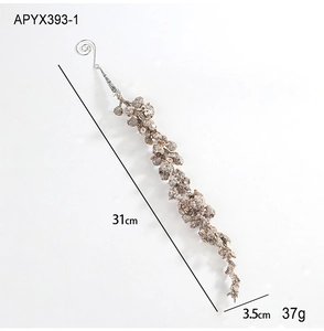Macro view of 31cm champagne gold glitter tassel ornament with spiral metal hook
