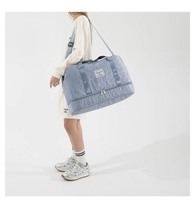 Blue travel bag with star quilted pattern and independent bottom shoe compartment