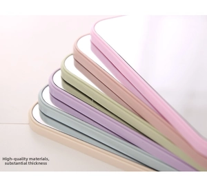 Close-up of portable square makeup mirrors with thick rounded frames in multiple colors