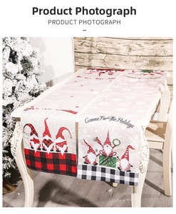 Close-up of festive Christmas gnome table runners with plaid patterns and holiday text