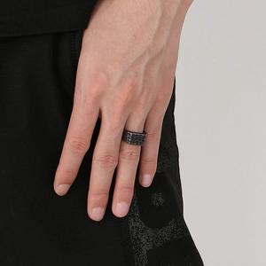 Detailed view of men's vintage rectangle ring featuring textured hammered silver finish