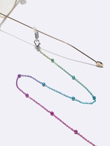 Close-up of multicolor gradient eyeglass chain with colorful beads and secure rubber loops