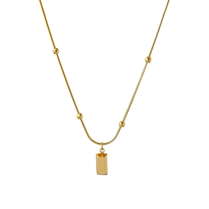 Minimalist gold titanium steel necklace featuring small beads and a rectangular pendant