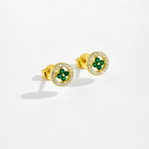 Detail of S925 silver gold-plated stud earring with green clover and white stones