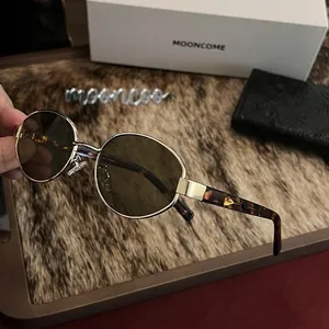 Retro oval cat-eye sunglasses with gold metal frame and brown lenses for women