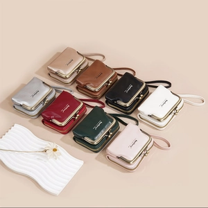 Flat lay of litchi pattern mini wallets in eight colors with metal zippers