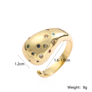 Detail of gold-plated geometric ring with colorful zircons and adjustable size measurements