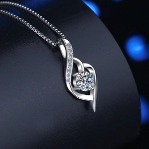 Macro detail of S925 sterling silver heart pendant with brilliant moissanite stone