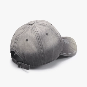 Distressed grey washed cotton baseball cap with ripped brim and adjustable metal strap