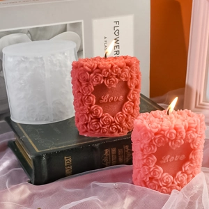 Detailed macro view of 3D rose heart love silicone mold with finished scented candles