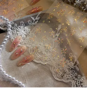 Detail of aurora laser gold firework nail stickers M-1358 with stars and butterfly motifs