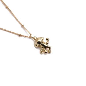 Polished gold-plated necklace featuring a detailed 3D astronaut pendant on white background