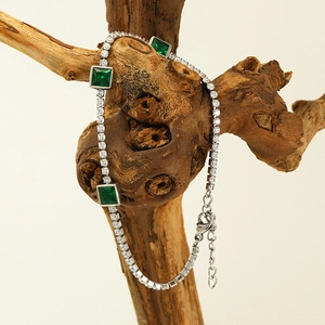 Elegant silver titanium steel bracelet with square green gemstones and clear crystals