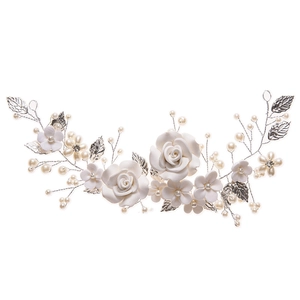 Silver bridal hair vine with white flowers, pearls and leaves for wedding hairstyles