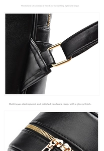 Detail of polished gold zipper and hardware on black pebbled leather backpack