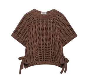 Detail of brown hollow-out knit top showing the vertical crochet texture and side bow ties