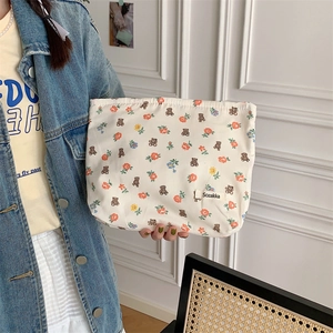 Floral cotton canvas clutch bag with cute bear patterns and Sozakka label