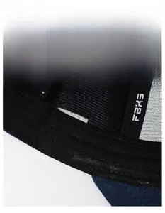 Detail view of the wide black sweatband and embroidered brand label inside the baseball cap