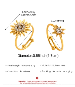 Detail of 18K gold-plated celestial sun and star rings with set cubic zirconia stones