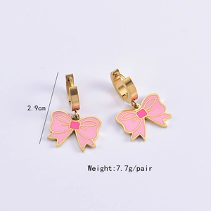 Pink bow earrings detail showing 2.9cm length and 7.7g weight on a lilac background