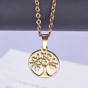 Detailed view of an 18k gold plated tree of life pendant on a polished necklace
